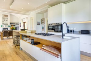 Stunning open plan kitchen onto dining area and main lounge .