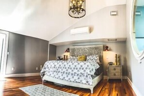 Master Suite with balcony access and en suite bathroom and laundry