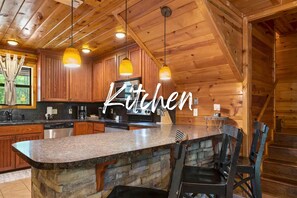 Cook up a storm in this fully equipped kitchen, where rustic charm meets modern convenience. Perfect for preparing delicious meals during your stay.