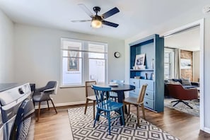 Spacious second multi-functional space with the dinning room, second desk, and laundry