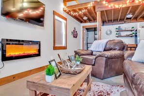 Cozy up by the fireplace and enjoy a movie.