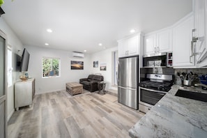 Enjoy the open kitchen w/gorgeous granite countertops