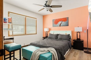 Master bedroom featuring a queen size bed and a Smart TV for streaming.