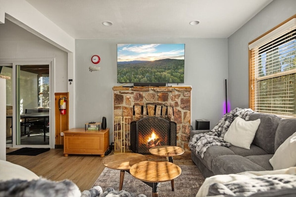 Watch the snow fall as you warm up by the fireplace.