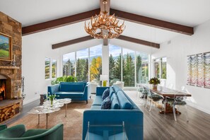 Large living room with cathedral ceilings, 
 & wood-burning fireplace