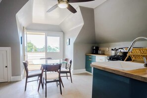 Recently renovated kitchen complemented by the high ceilings and quick access to balcony