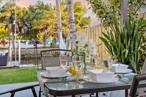 Dine under the stars in your own private tropical garden.