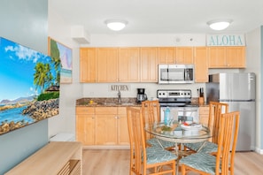 Cook delicious meals in your fully equipped kitchen with full-size appliances, share it with loved ones in your dining table with 4 chairs.