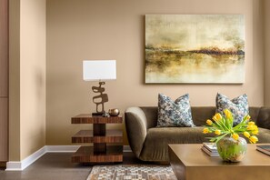 Living room featuring a 65" 4K UHD TV