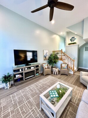 Living room equipped with new 65 inch Samsung Smart TV.