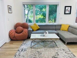 Living room with TV on wall