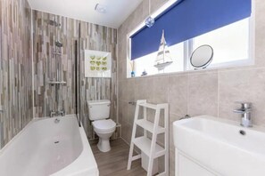 The main bathroom is downstairs, with a full bath and a very good shower