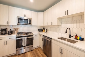 You’ll love preparing meals in this fully equipped kitchen, designed with all the appliances and utensils you need for a comfortable, home-like experience.