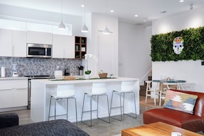 Large kitchen island with barstools.