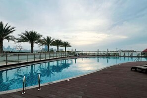 Rooftop Retreat: Soak up the sun by the shimmering pool with breathtaking skyline views!