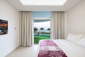 Bedroom: Indulge in luxury with panoramic views and modern decor—your ultimate getaway awaits!