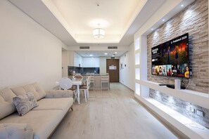 Living Room: Bright, modern space with a chic sofa, elegant decor, and an entertainment-ready setup!