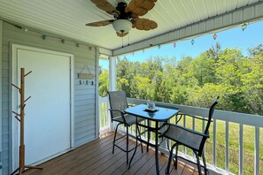 Equipped with a ceiling fan for extra comfort and a charming string of hanging lights, the balcony is the perfect place to cap off your busy day with a refreshing beverage under the starry sky.