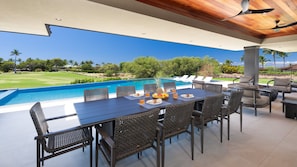 Enjoy meals poolside on the covered lanai