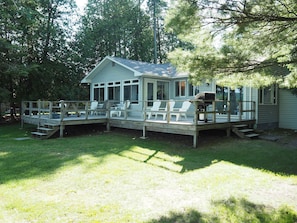 OVERALL:  The back of the house, highlighting the large backyard deck and the large backyard.