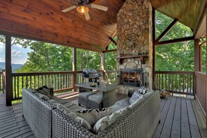 Big wood-burning outdoor fireplace where you can relax and unwind