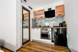 Streamlined kitchenette with a touch of modern charm