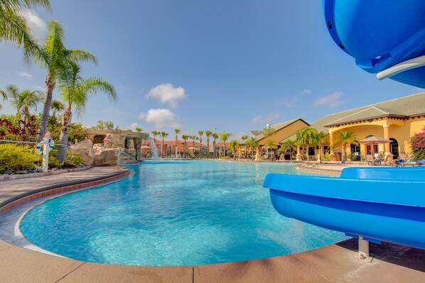 Paradise Resort Pool in Kissimmee Florida - Experience paradise at our resort pool oasis - A picturesque setting surrounded by tropical blooms and swaying palms