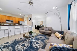 Elegant Living area of the Townhouse in Kissimmee Florida - Beautiful living room with an open layout, creating a sense of spaciousness - Stylish furniture arrangement providing comfort and a cohesive look - Cozy Sofas