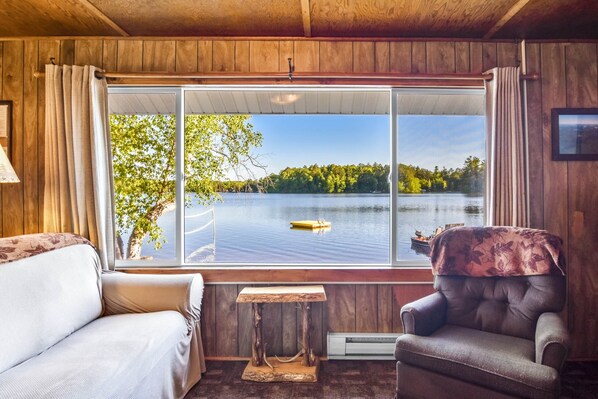 Cottage sits just feet from the shore of Lake Thompson.