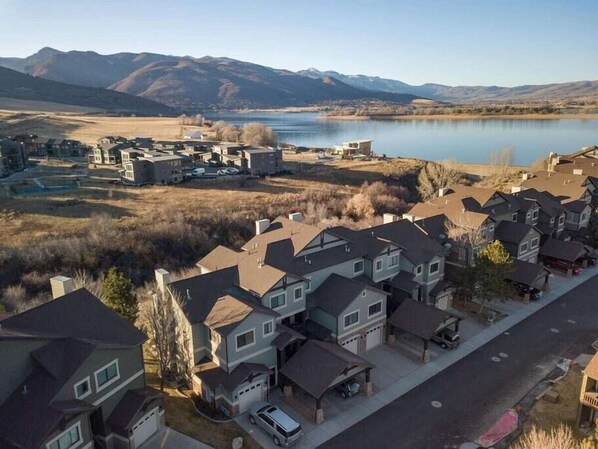 Aerial view of Lakeside Village, with lake and mountains in the background.
