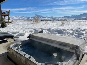 Relax in the private jetted hot tub located on the lower level patio.