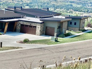 Exterior view of the home from the hill across the street. 