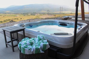 Relax and enjoy the view in the jetted hot tub, accessible from the lower level.