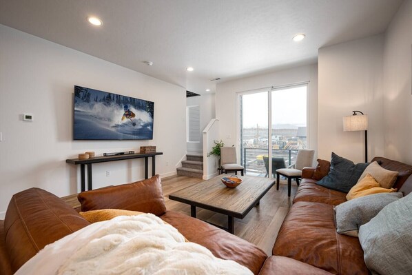 Adjacent to the living room, find access to the upstairs bedrooms, seamlessly extending the comfort and convenience of your stay. 