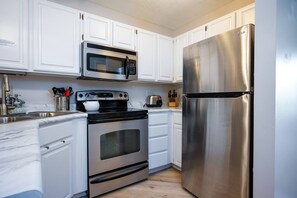 Cook your favorite meals in a kitchen bathed in natural light that enhance the culinary experience.