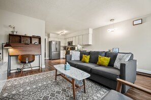 The open-concept living space, complete with a dining area, facilitates effortless conversation with family and friends.