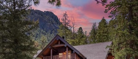 This is not photoshopped! Mountains in front and behind this custom log home.