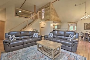 Settle into our spacious living room with luxurious leather seating and an open loft layout that's perfect for family gatherings and relaxing evenings.