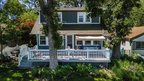 porch swing and high top table for two for a calming lakefront view