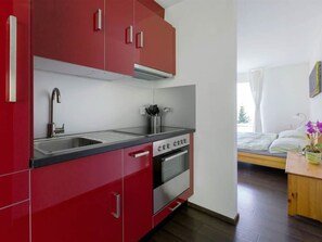 Cabinetry, Countertop, Furniture, Property, Kitchen Sink, Sink, Tap, Kitchen, Orange, Wood