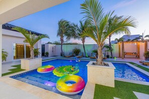 Savor the transition from day to night in the comforting embrace of your private pool sanctuary.