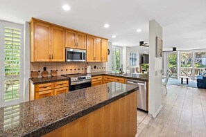 Beautiful granite countertops and plenty of  cabinet space to store groceries and other necessities.