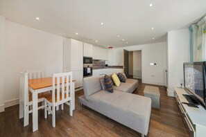 Spacious living room, dining area, and an open plan, fully-equipped kitchen 