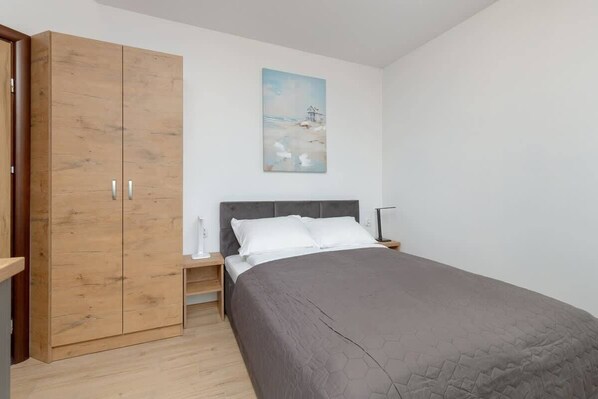 Cosy space of the studio with sleeping area and closet.