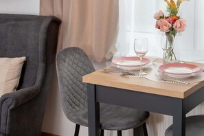 Dining table with tableware.