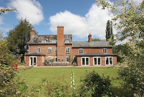 South side of Monnington House, south facing terrace with outdoor sofas & chairs