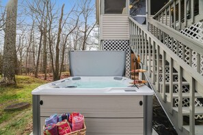 Experience beachfront bliss with a private hot tub, perfect for sunsets and relaxation. Unwind in our luxurious villa with a hot tub just steps from the serene lake, offering the ultimate peaceful getaway.