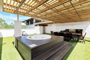 Walk up the spiral staircase to the private rooftop where you will find a barbeque area, additional eight-seater outdoor dining and a spa. 
