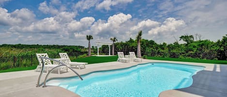 Soak up the sun by the private outdoor pool at Sea Haven
