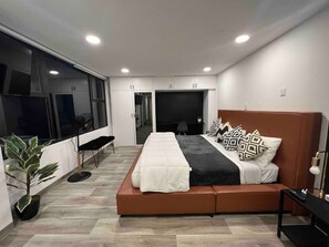 Bedroom 5 has a beautiful king bed and a laptop-friendly workspace